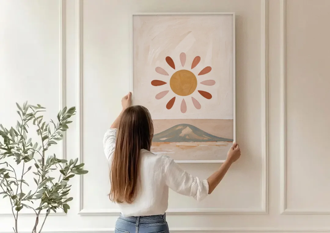 Boho Paintings Sun Rising Over a Gentle Hill canvas wall art being hung on a paneled wall