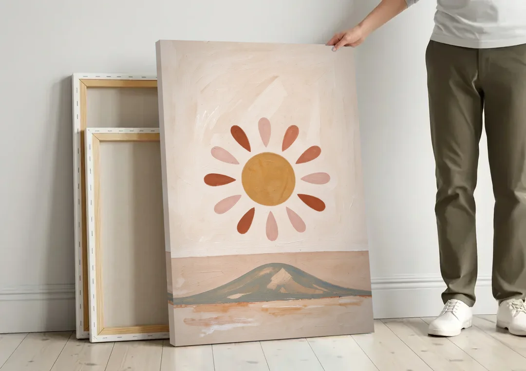 Boho Paintings Sun Rising Over a Gentle Hill canvas wall art leaning against a wall next to blank canvases