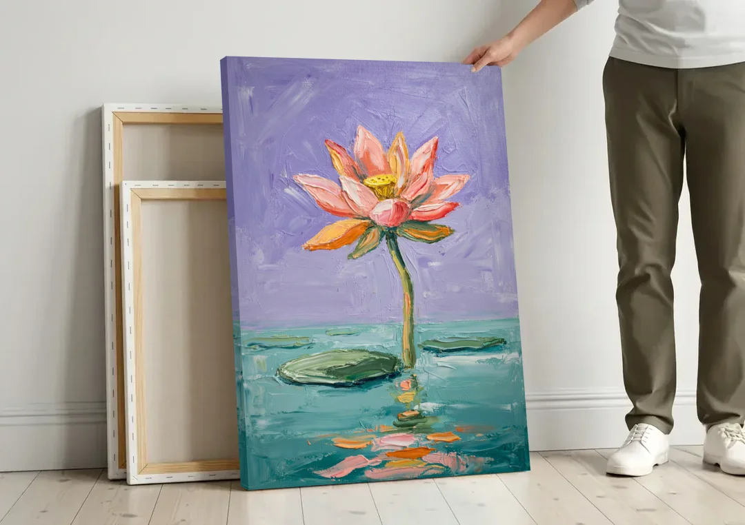 Bold Floral Wall Art Lotus Over Teal Water canvas wall art leaning against a wall next to blank canvases