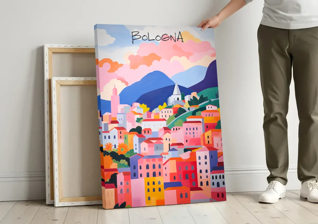 Bologna Art of Pink Rooftops canvas wall art leaning against a wall next to blank canvases