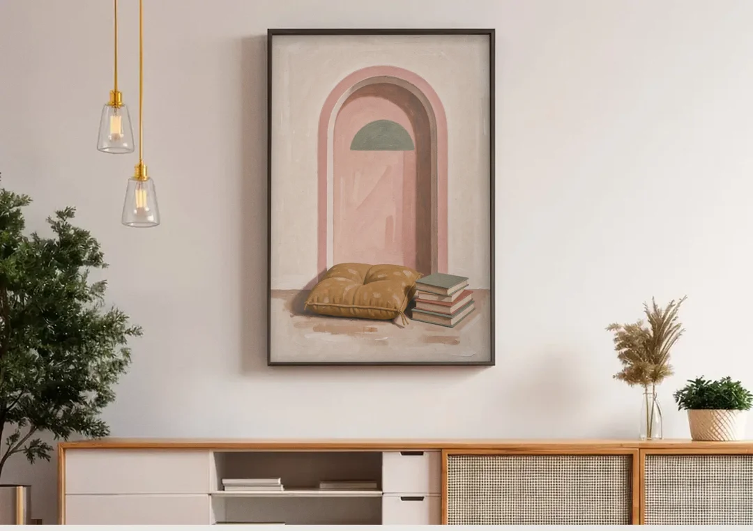 Book Nook Decor with Mustard Cushion in Blush Arch canvas wall art above a wooden sideboard under pendant lights