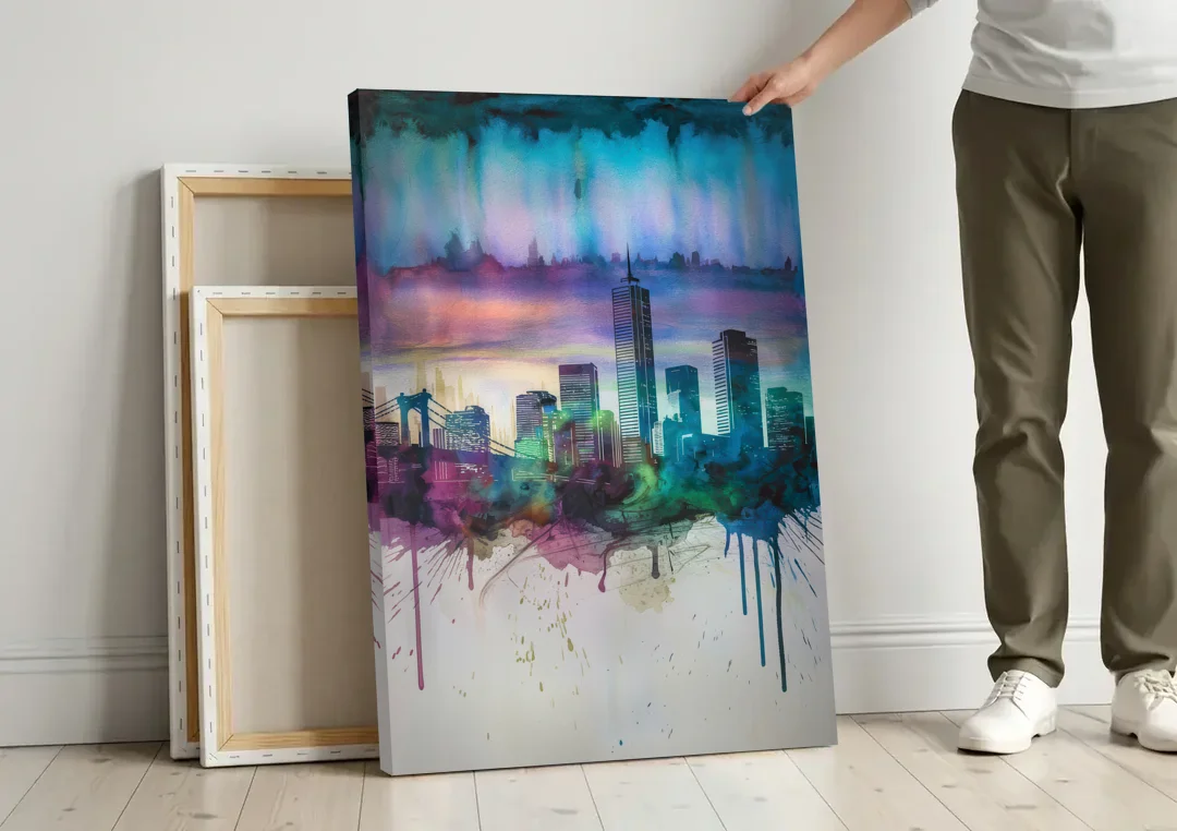 Boston Skyline in Watercolor canvas wall art leaning against a wall next to blank canvases