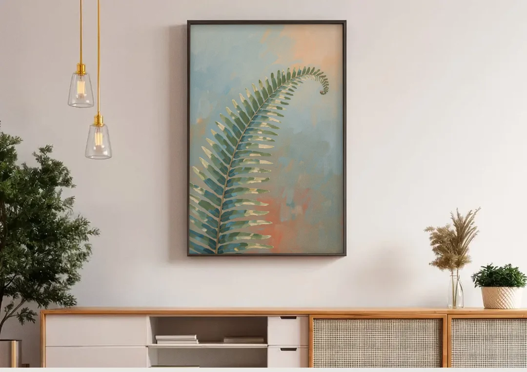 Botanical Arching Fern Frond in Early Light canvas wall art above a wooden sideboard under pendant lights