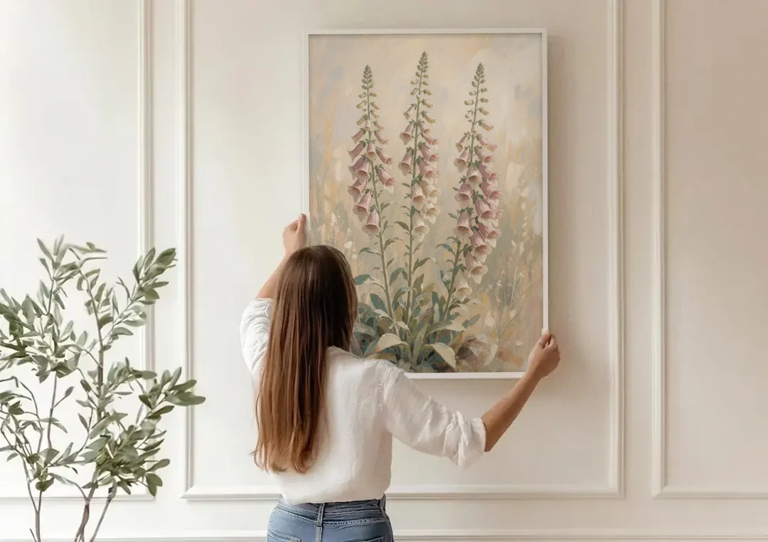 Botanical Wall Decor with Three Foxglove Spires canvas wall art being hung on a paneled wall