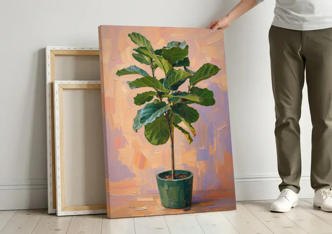 Botanical Young Fiddle-Leaf Fig in Green Pot canvas wall art leaning against a wall next to blank canvases