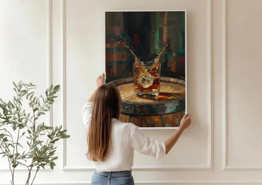 Bourbon Painting with an Ice Cube Splash canvas wall art being hung on a paneled wall