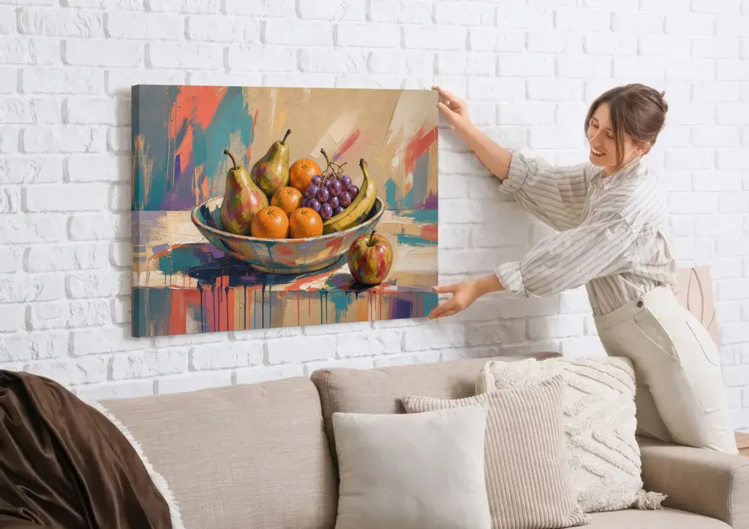 Bowl of Fruit Painting with Runaway Apple canvas wall art being hung on a white brick wall above a sofa
