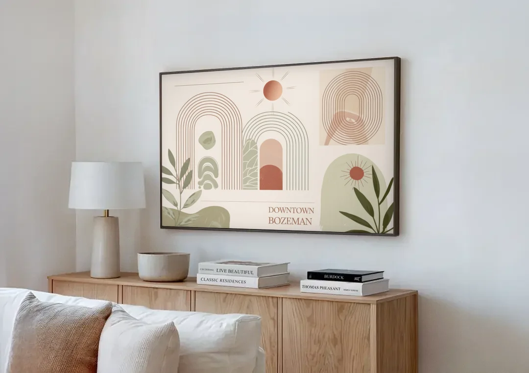 Bozeman Downtown Charm canvas wall art above a wooden sideboard next to a sofa