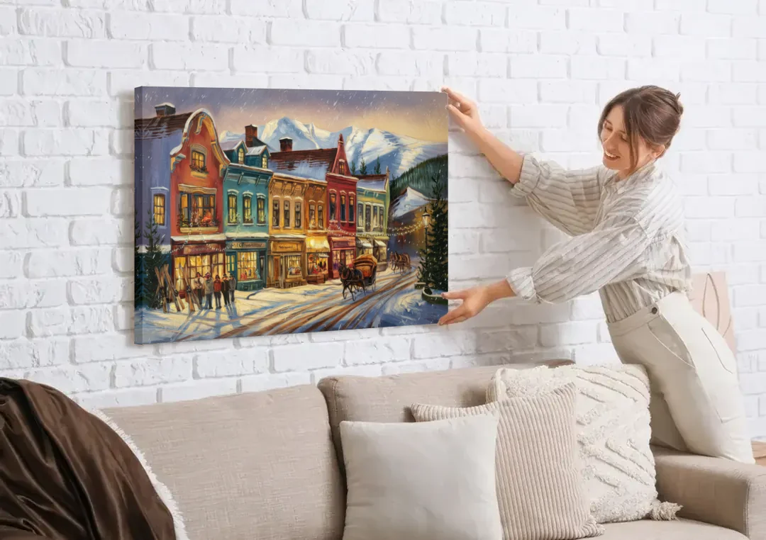 Breckenridge Historic Downtown canvas wall art being hung on a white brick wall above a sofa