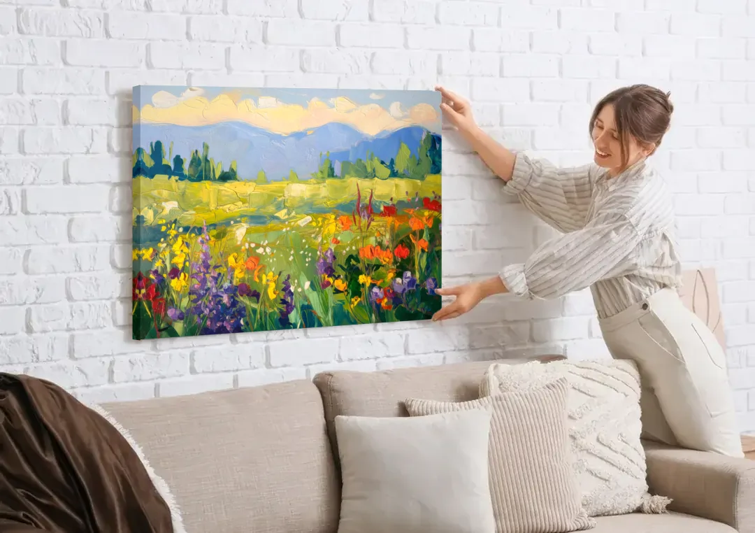 Breckenridge Summer Wildflowers canvas wall art being hung on a white brick wall above a sofa