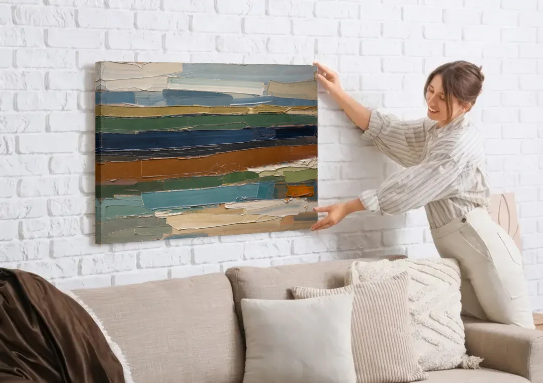 Brown Abstract Wall Art of Weathered Strata canvas wall art being hung on a white brick wall above a sofa