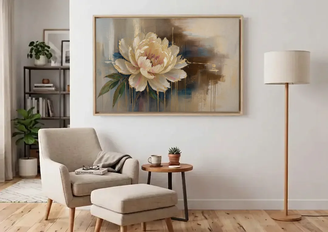 Brown Flower Wall Art with a Gilded Ivory Peony canvas wall art above an armchair in a bright living room