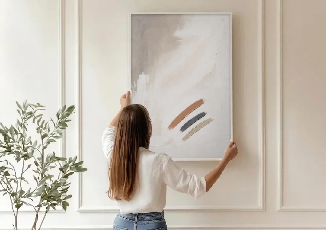 Brushstroke Wall Art Trio on Chalk White canvas wall art being hung on a paneled wall