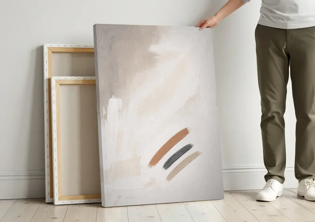 Brushstroke Wall Art Trio on Chalk White canvas wall art leaning against a wall next to blank canvases