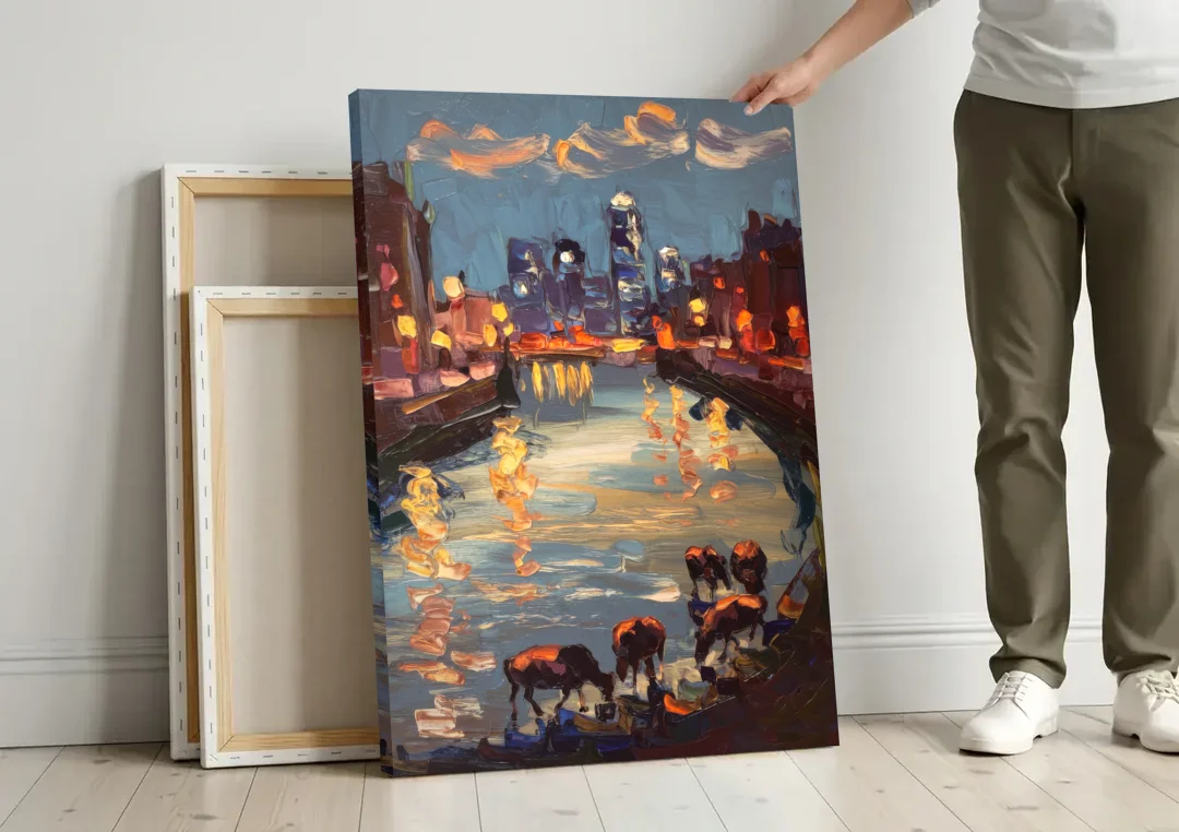 Buffalo Canalside at Night canvas wall art leaning against a wall next to blank canvases