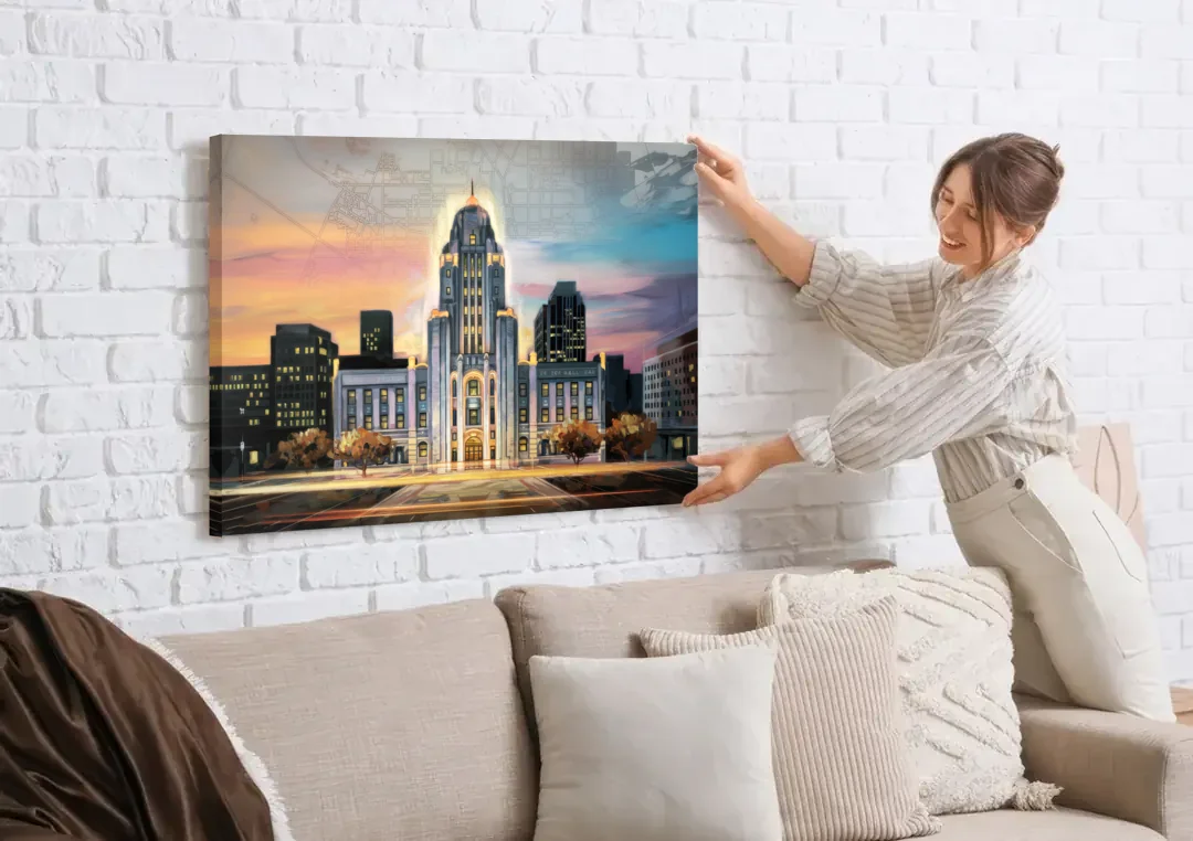 Buffalo City Hall Iconic View canvas wall art being hung on a white brick wall above a sofa