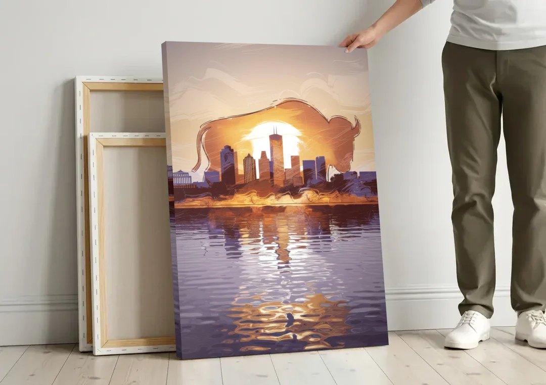 Buffalo Cityscape Reflection canvas wall art leaning against a wall next to blank canvases