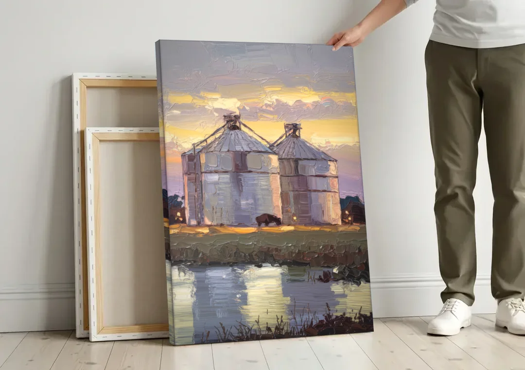 Buffalo Grain Silos at Dusk canvas wall art leaning against a wall next to blank canvases