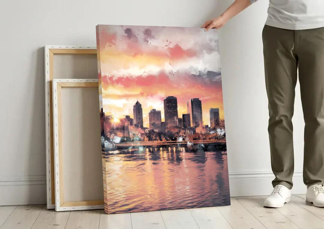 Buffalo Skyline at Sunset canvas wall art leaning against a wall next to blank canvases