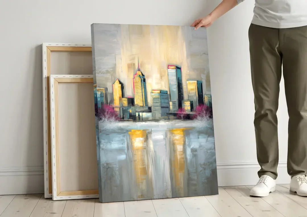 Buffalo Skyline in Winter canvas wall art leaning against a wall next to blank canvases