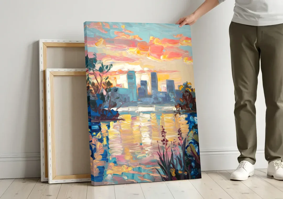 Buffalo Waterfront Sunrise canvas wall art leaning against a wall next to blank canvases