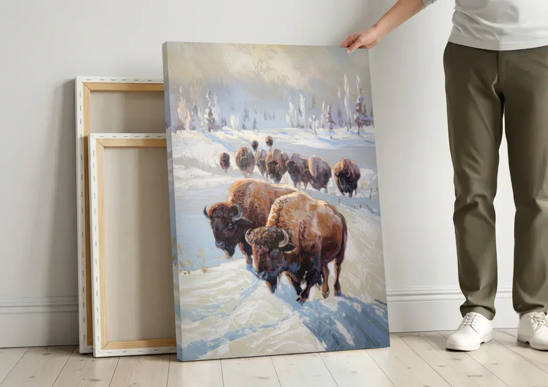 Buffalo Winter Wonderland canvas wall art leaning against a wall next to blank canvases