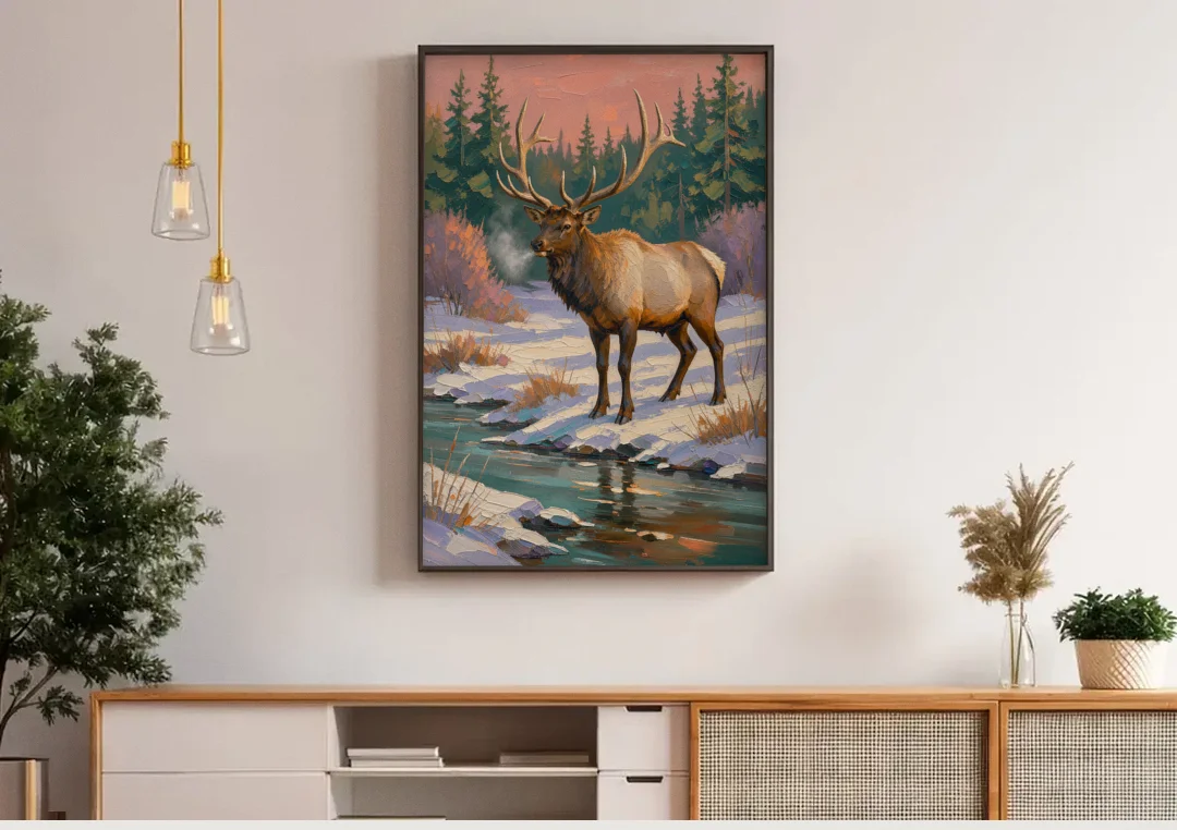 Bull Elk at the Snowy Creek in Winter canvas wall art above a wooden sideboard under pendant lights
