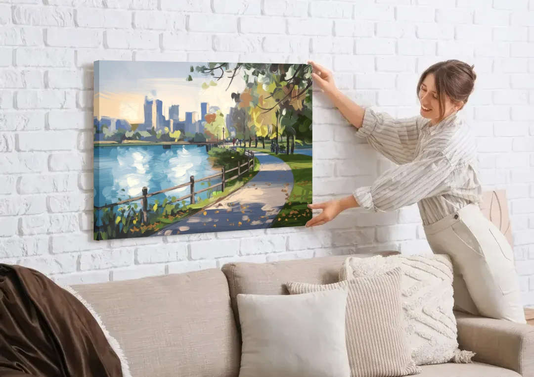 Burlington Lakefront Pathways canvas wall art being hung on a white brick wall above a sofa