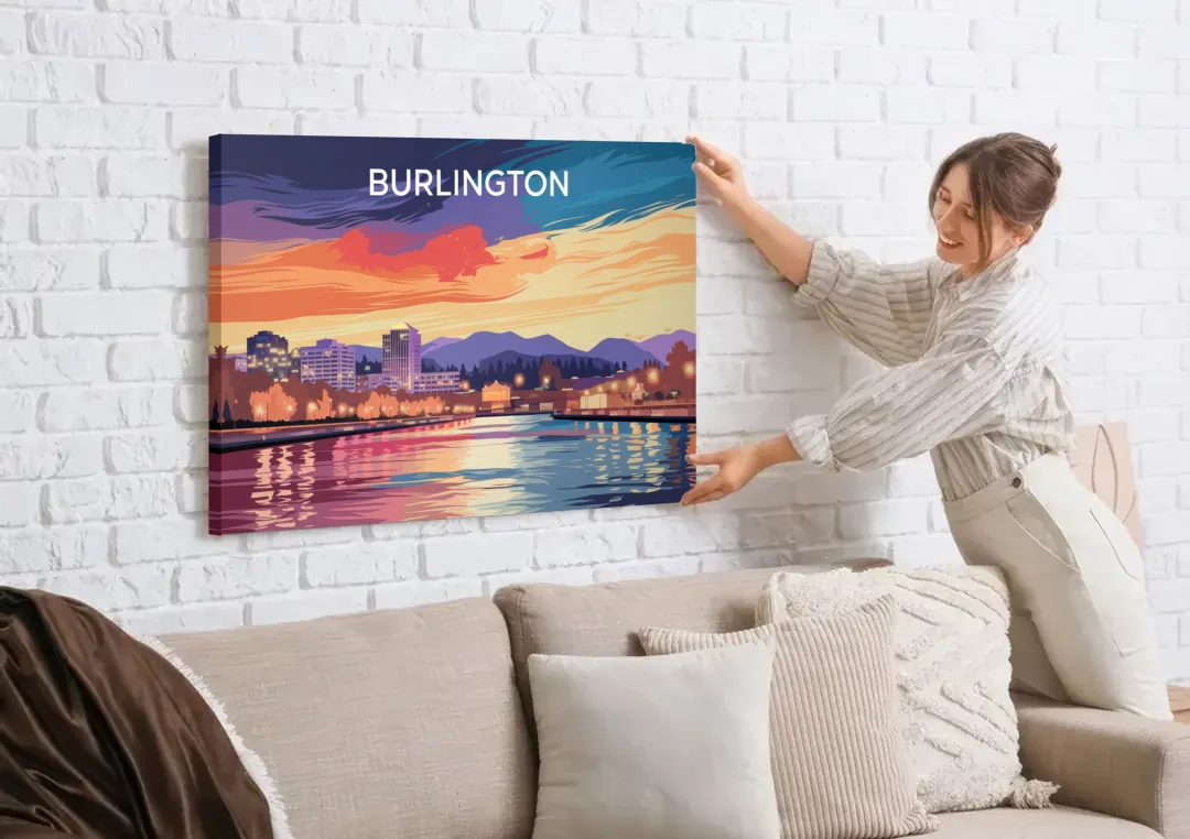 Burlington Skyline At Sunset canvas wall art being hung on a white brick wall above a sofa