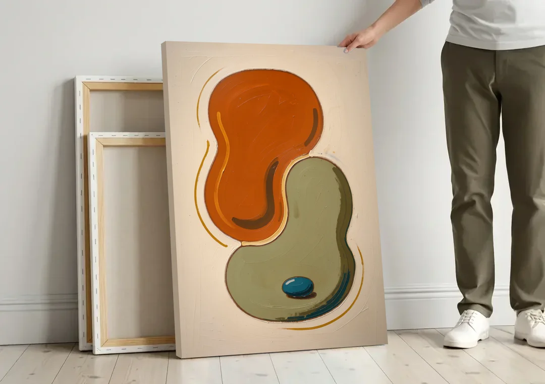Burnt Orange Abstract Wall Art with Sage Interlock canvas wall art leaning against a wall next to blank canvases