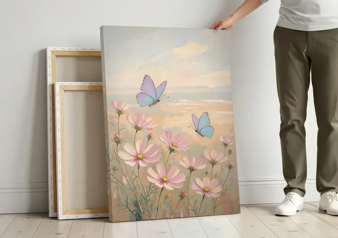 Butterfly Nursery Decor with Pastel Cosmos canvas wall art leaning against a wall next to blank canvases