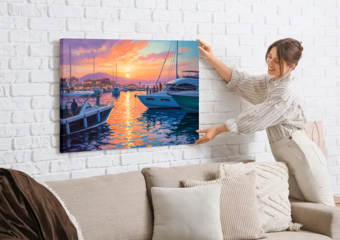 Cabo Marina Sunset canvas wall art being hung on a white brick wall above a sofa
