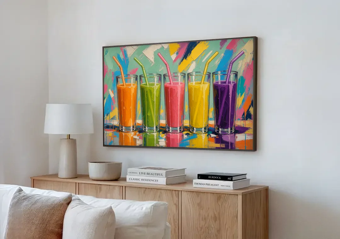 Cafe Canvas Art of Five Fresh Juice Glasses canvas wall art above a wooden sideboard next to a sofa
