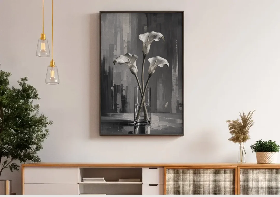 Calla Lily Wall Art with Three Stems in Glass canvas wall art above a wooden sideboard under pendant lights