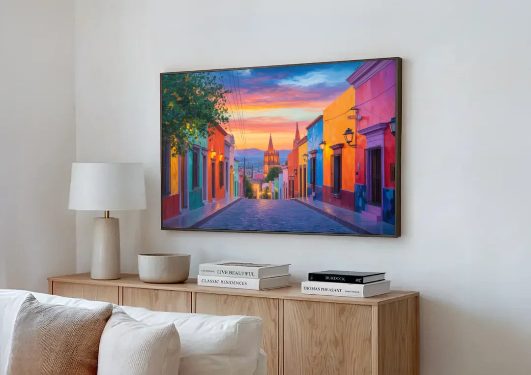 Calle Aldama Sunset canvas wall art above a wooden sideboard next to a sofa