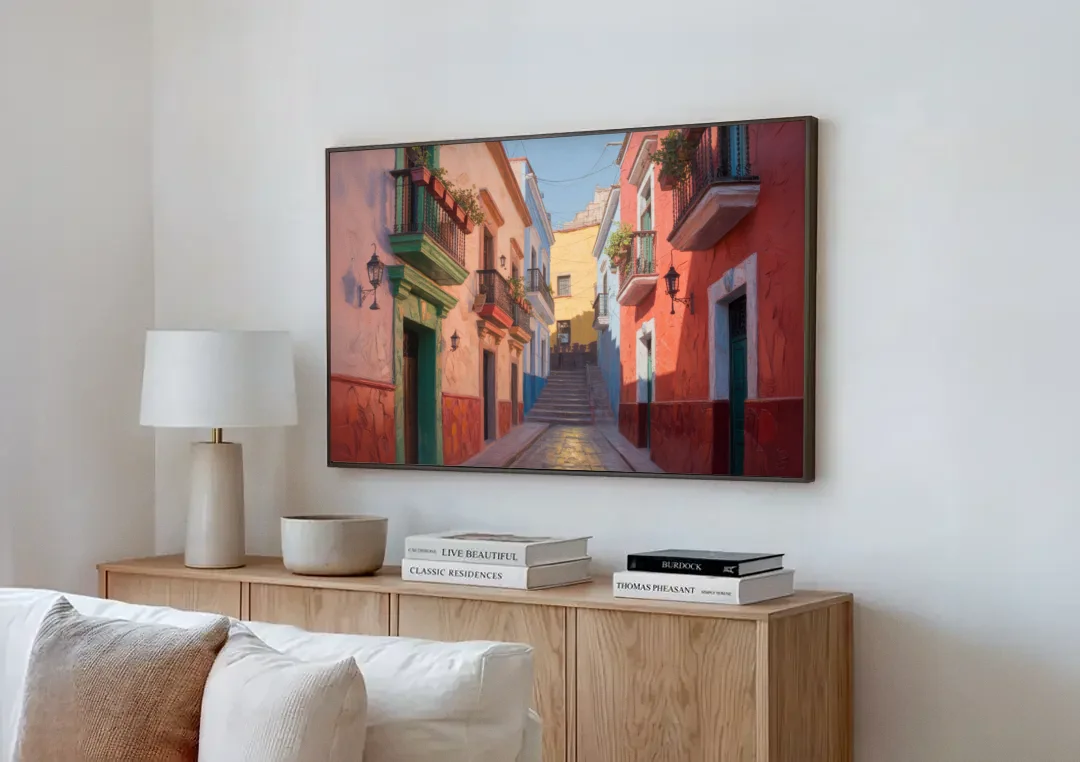 Callejón del Beso Alley canvas wall art above a wooden sideboard next to a sofa