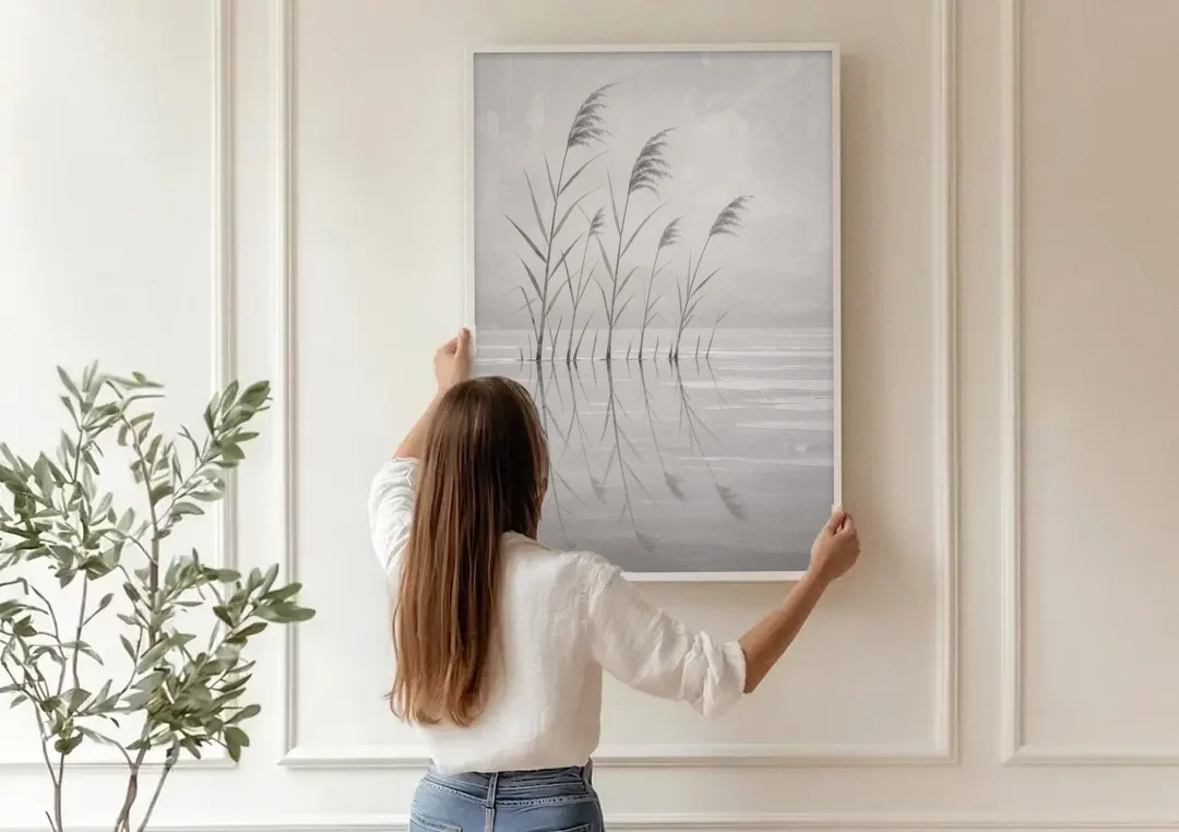 Calm Wall Art of Reeds in Still Water canvas wall art being hung on a paneled wall