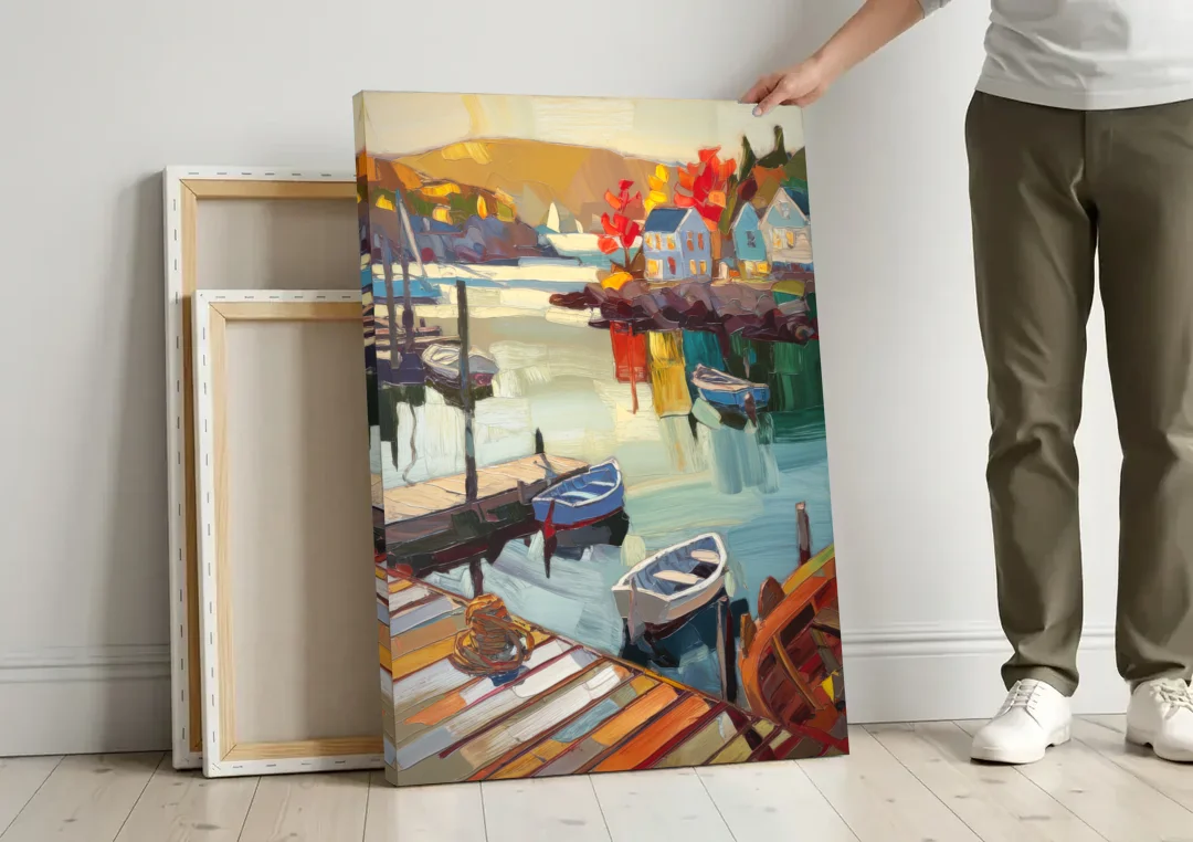 Camden Scenic Harbor View canvas wall art leaning against a wall next to blank canvases