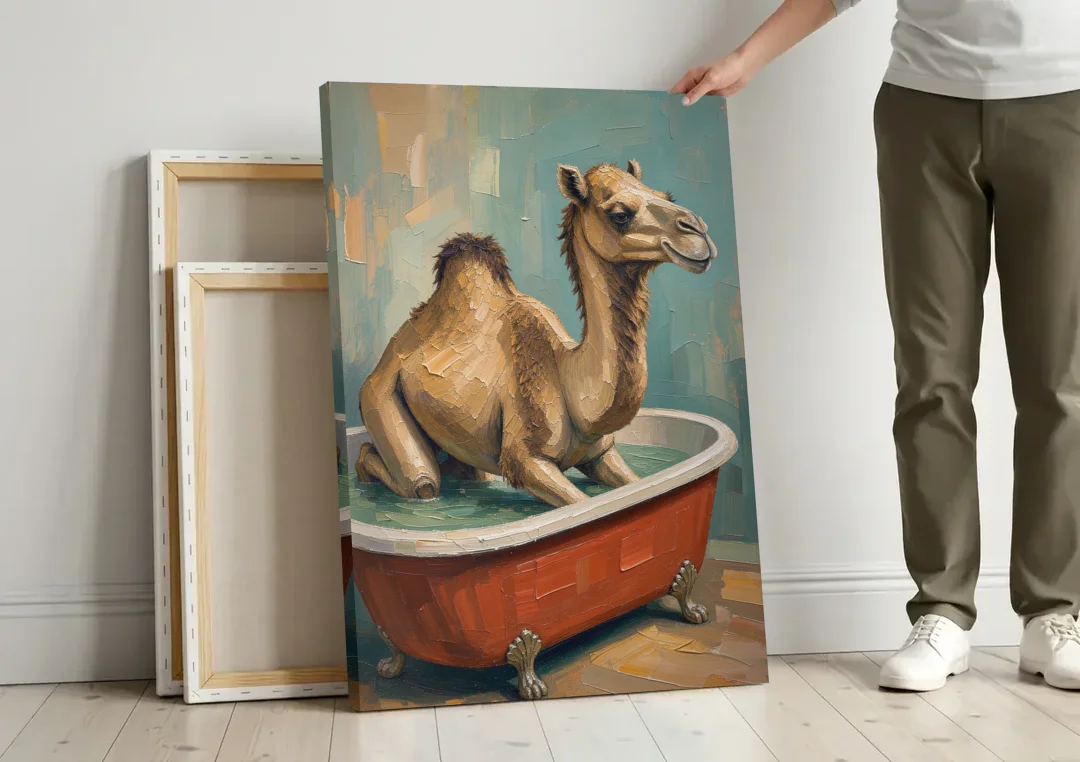 Camel Kneeling in a Clawfoot Tub canvas wall art leaning against a wall next to blank canvases