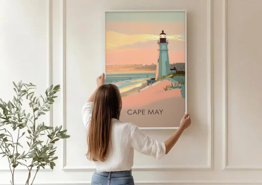Cape May Lighthouse Glow canvas wall art being hung on a paneled wall