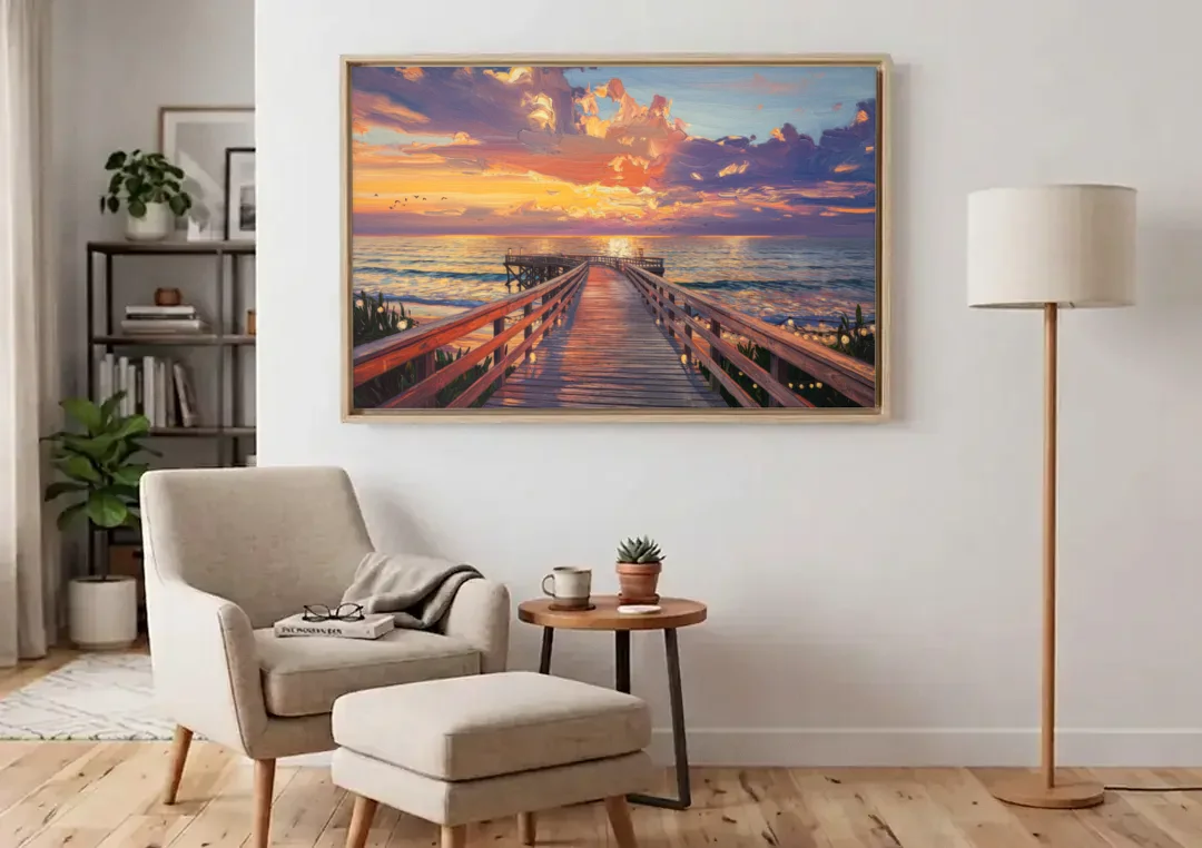 Cape May Sunset Pier canvas wall art above an armchair in a bright living room