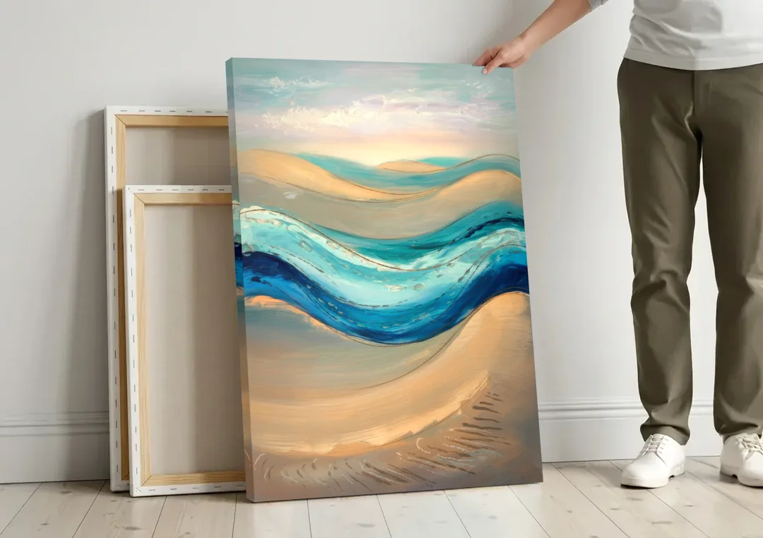 Cape May Waves and Dunes canvas wall art leaning against a wall next to blank canvases