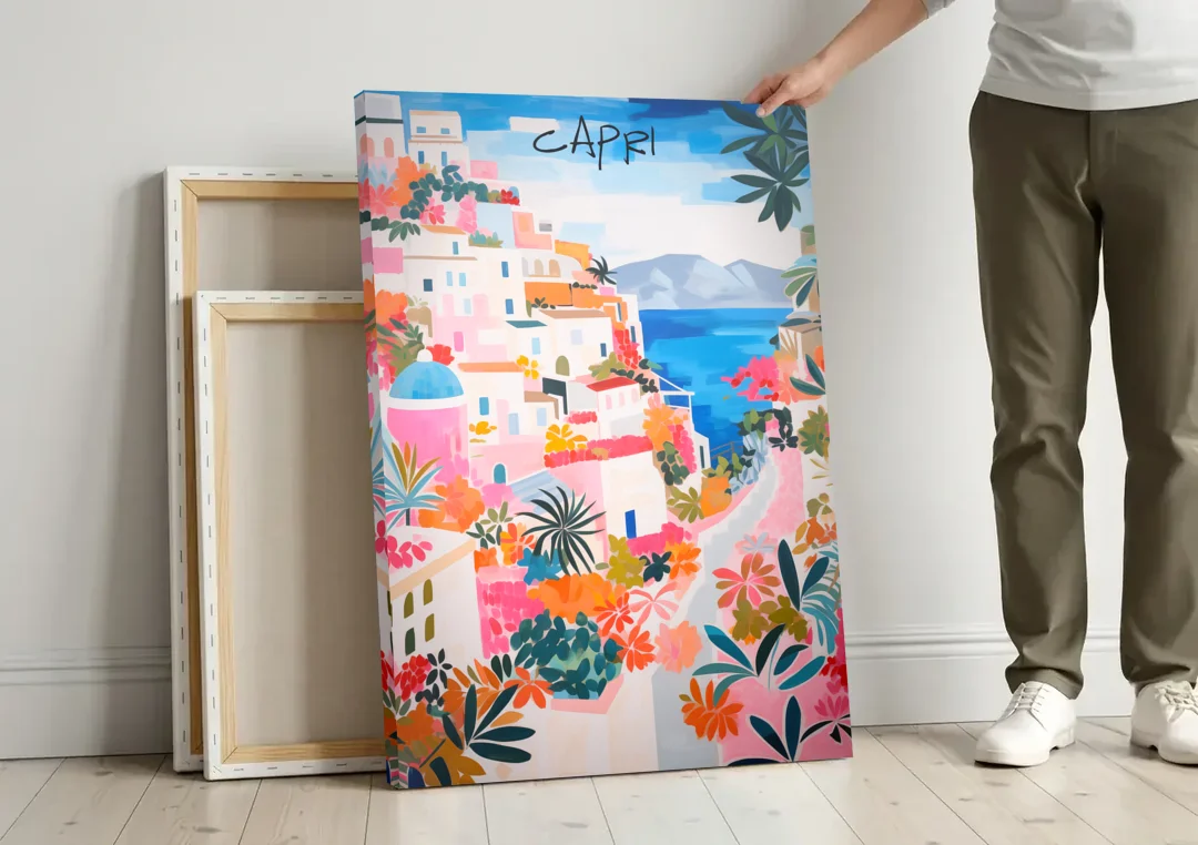 Capri Art of a Flowered Lane canvas wall art leaning against a wall next to blank canvases