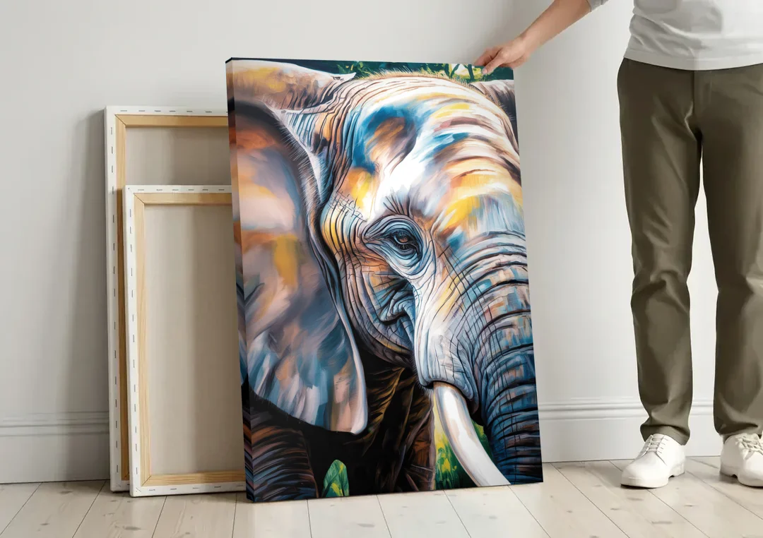 Captivating Elephant Eye Close-Up canvas wall art leaning against a wall next to blank canvases
