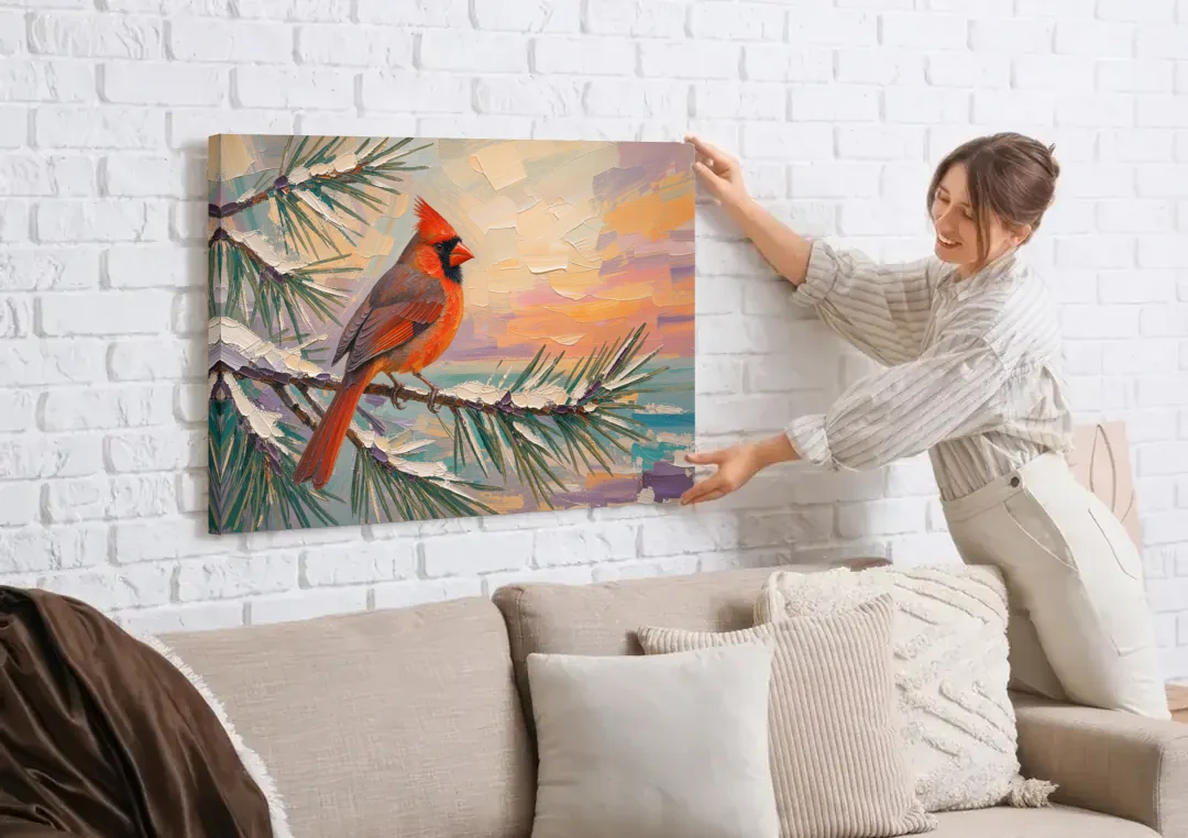 Cardinal Bird Painting at Winter Sunset canvas wall art being hung on a white brick wall above a sofa