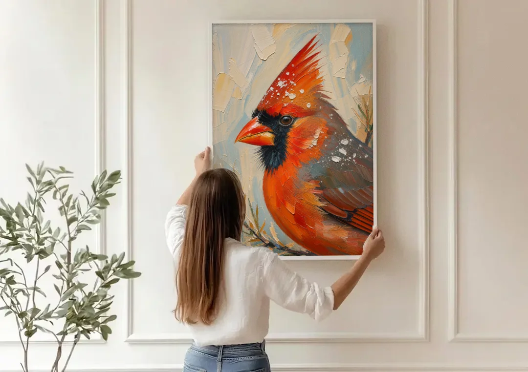 Cardinal Profile with Snow-Dusted Crest canvas wall art being hung on a paneled wall