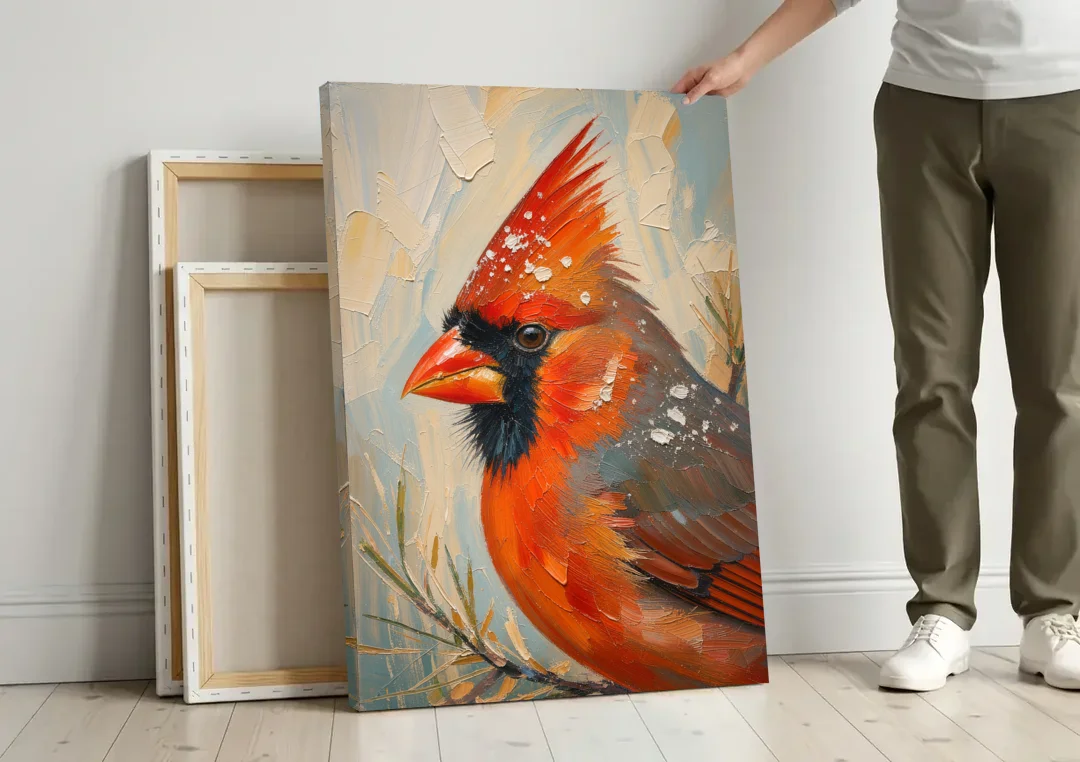 Cardinal Profile with Snow-Dusted Crest canvas wall art leaning against a wall next to blank canvases
