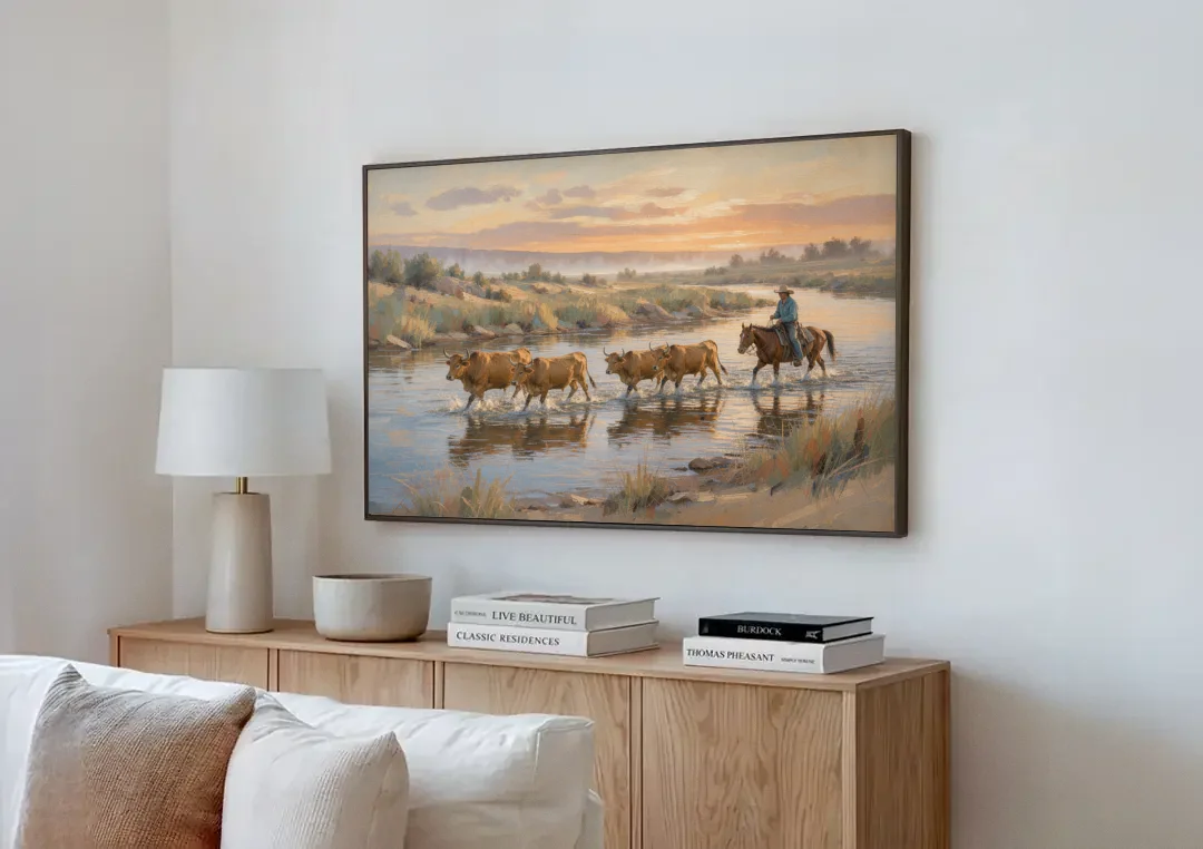 Cattle Drive Painting at the River Ford canvas wall art above a wooden sideboard next to a sofa