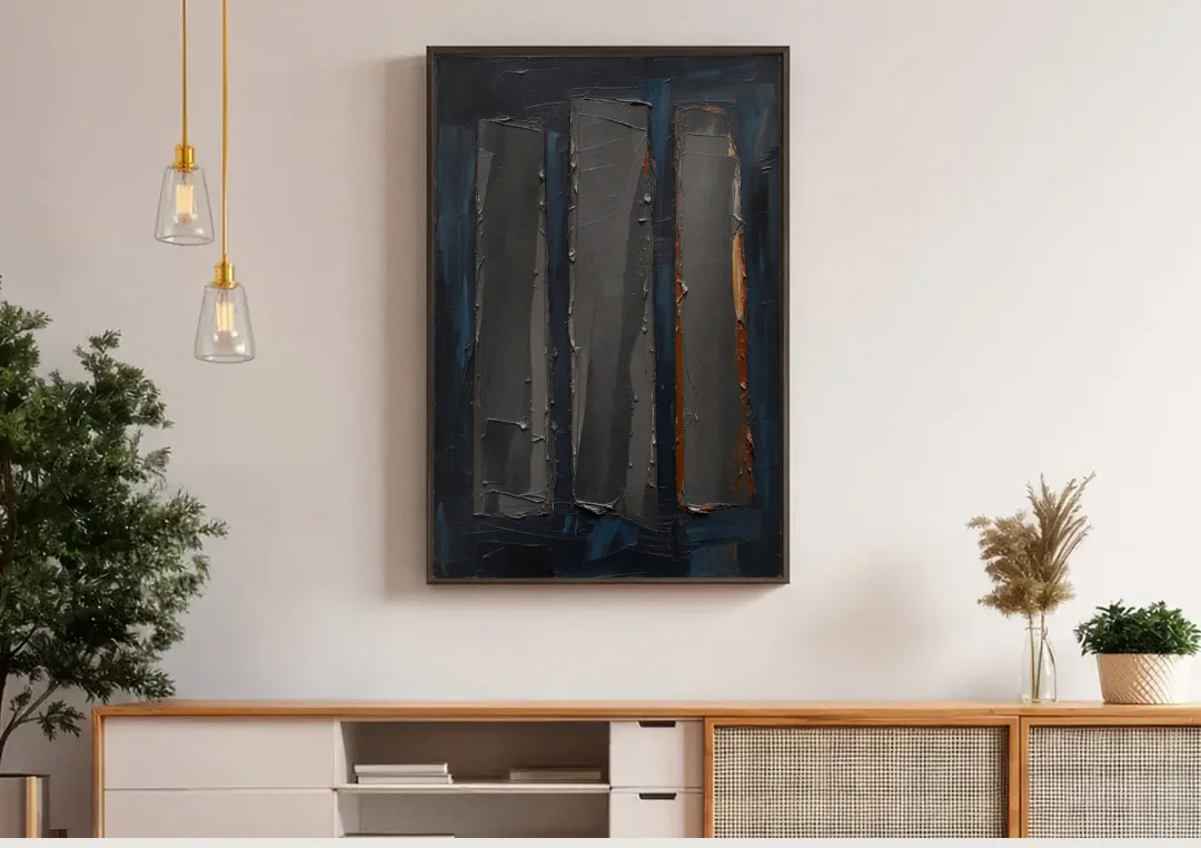 Charcoal Abstract Painting of Three Monoliths canvas wall art above a wooden sideboard under pendant lights