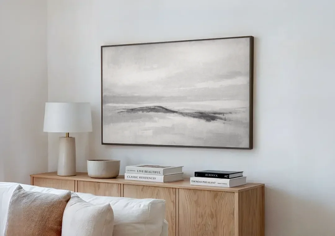 Large Black and White Charcoal Ridge in White Mist canvas wall art above a wooden sideboard next to a sofa